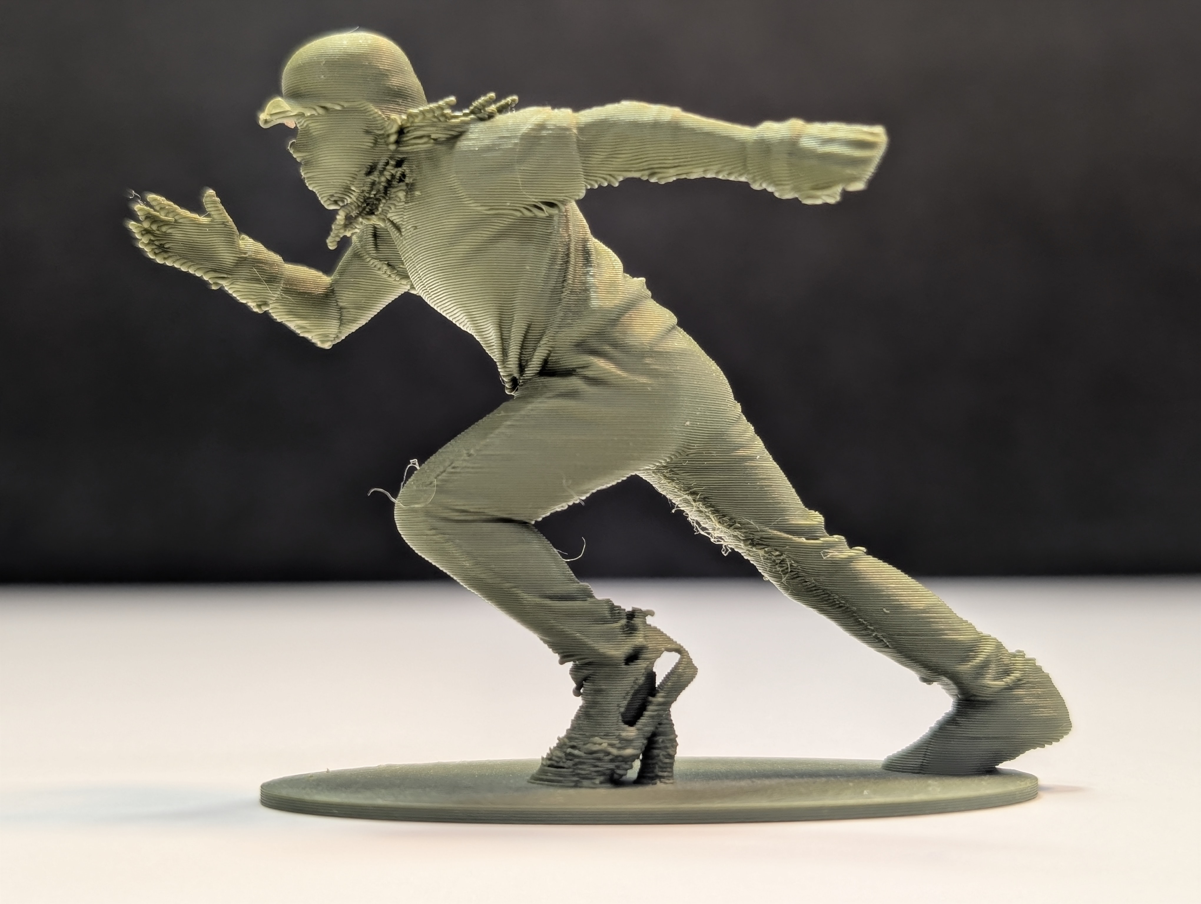 Runner figurine sprinting toward base