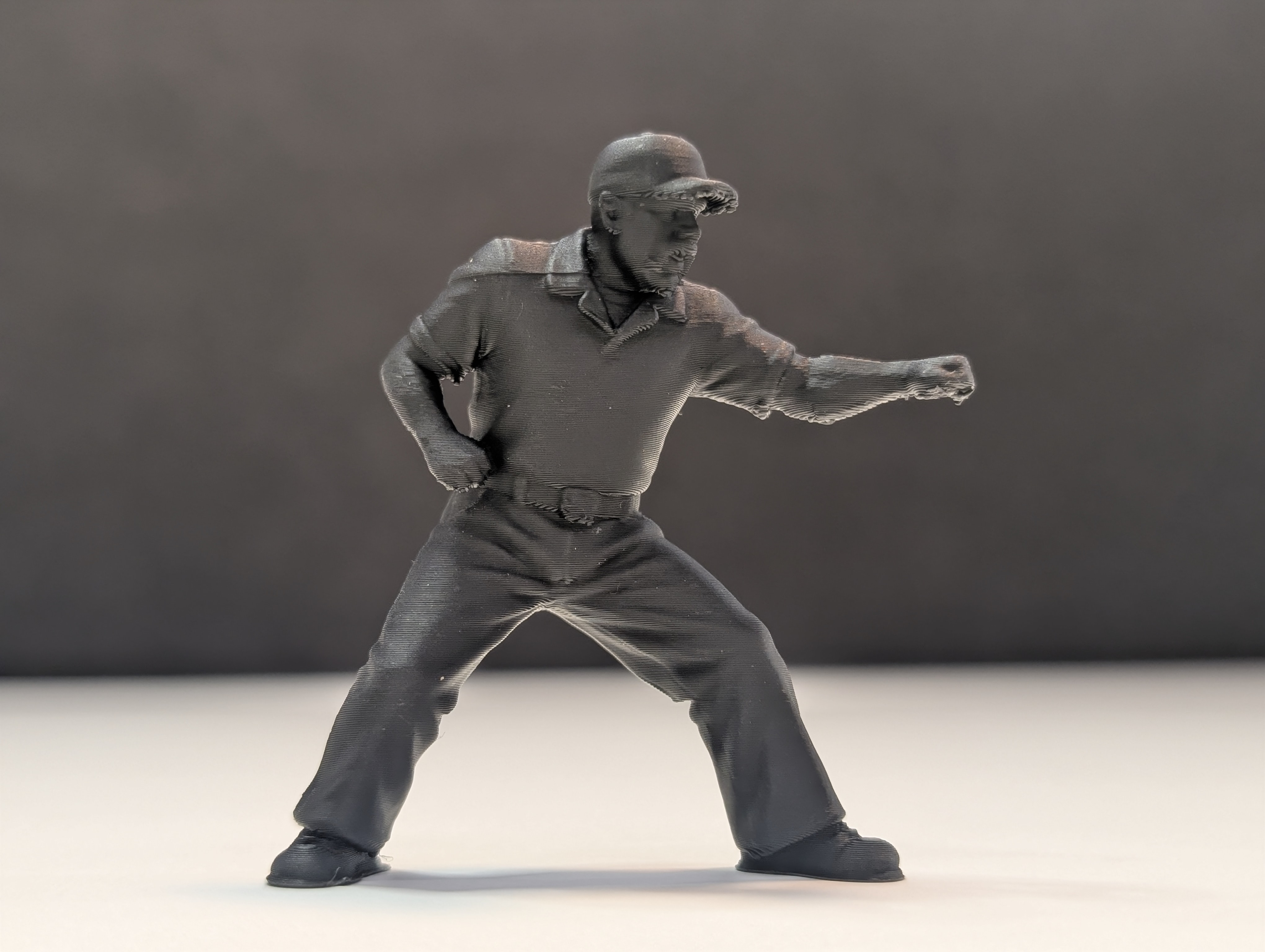Baseball Army Men umpire figurine making a call — black team, arms extended